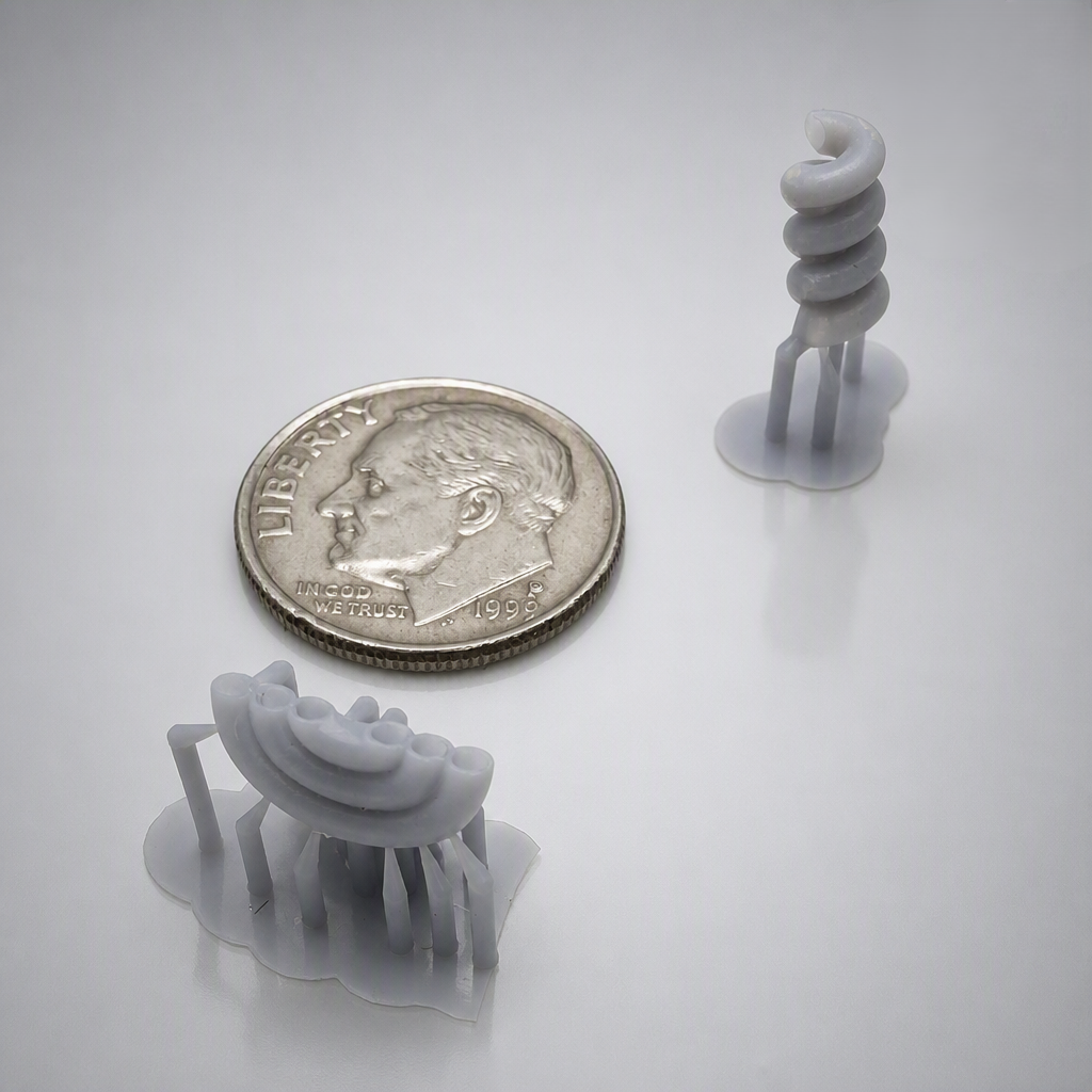 A 3D-printed helical tube with a 2mm outer radius, 1mm inner diameter, and 0.3mm wall thickness, showing resolution test results.